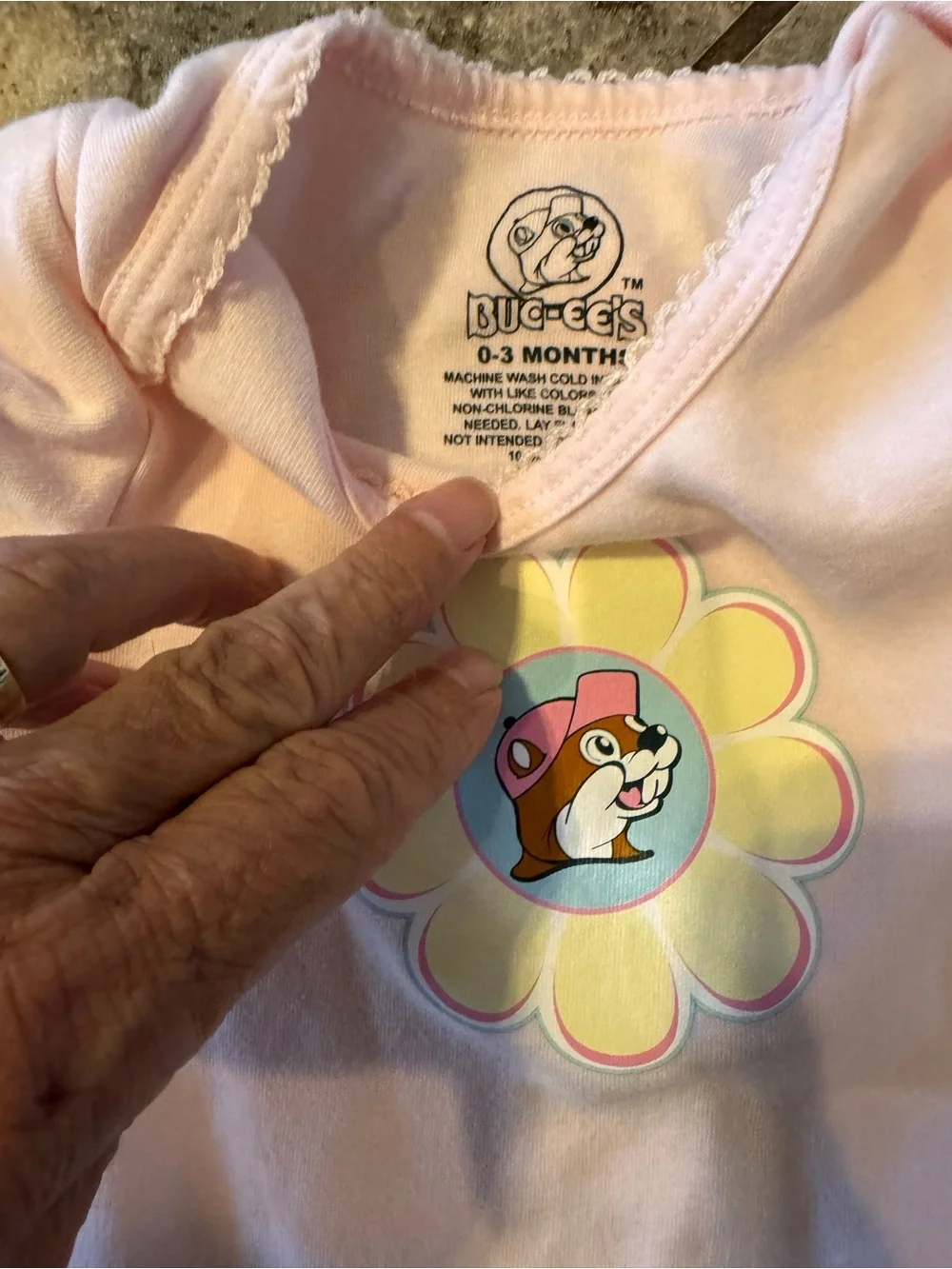 Baby girl bundle of Buc-ee’s onesie 3m & Penelope Mack fleece footie onesie 3-6M